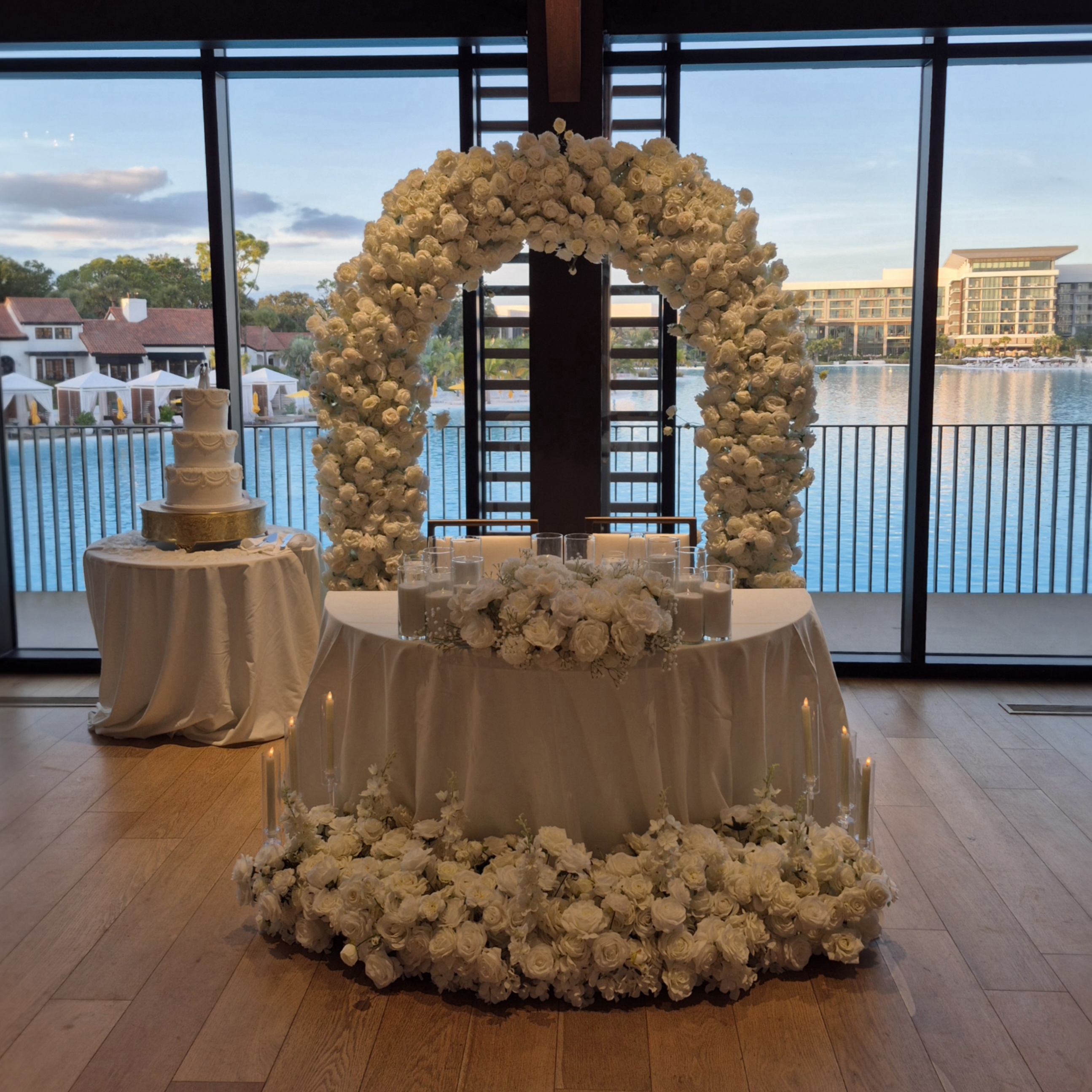 #AA0020 - White Rose Arch and Florals, 12 Sand Wax candles, 6 Tall Clear Candles, $450.00 White Rose Arch and Florals, 12 Sand Wax candles, 6 Tall Clear Candles